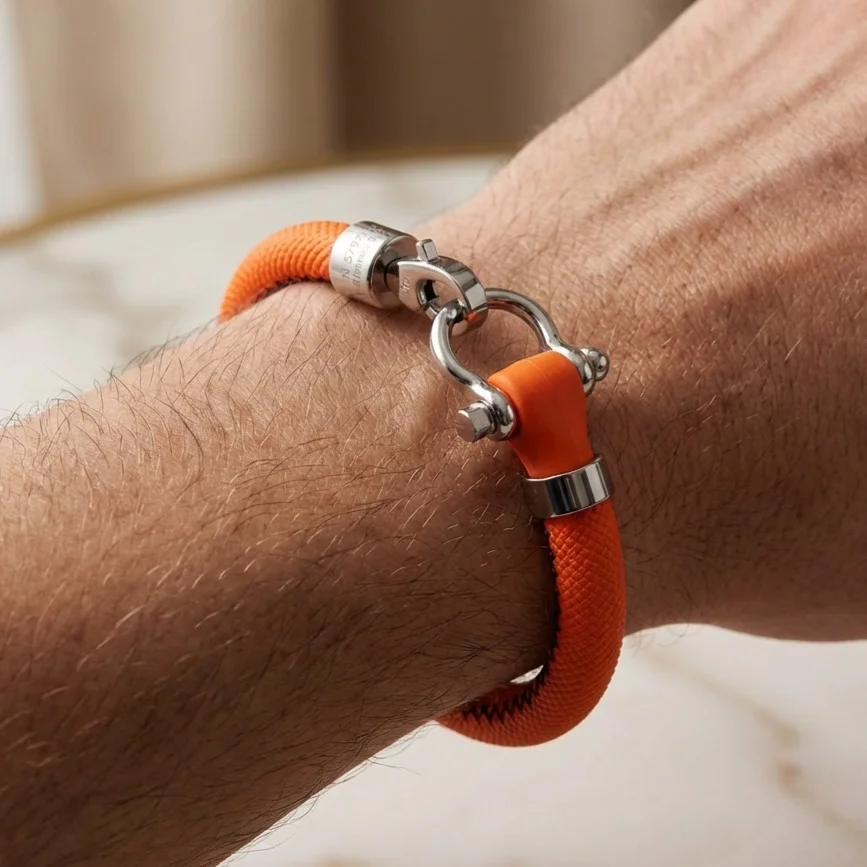 دستبند مردانه مدل امگا رابر با بند نارنجی و قفل استیل قایقرانی