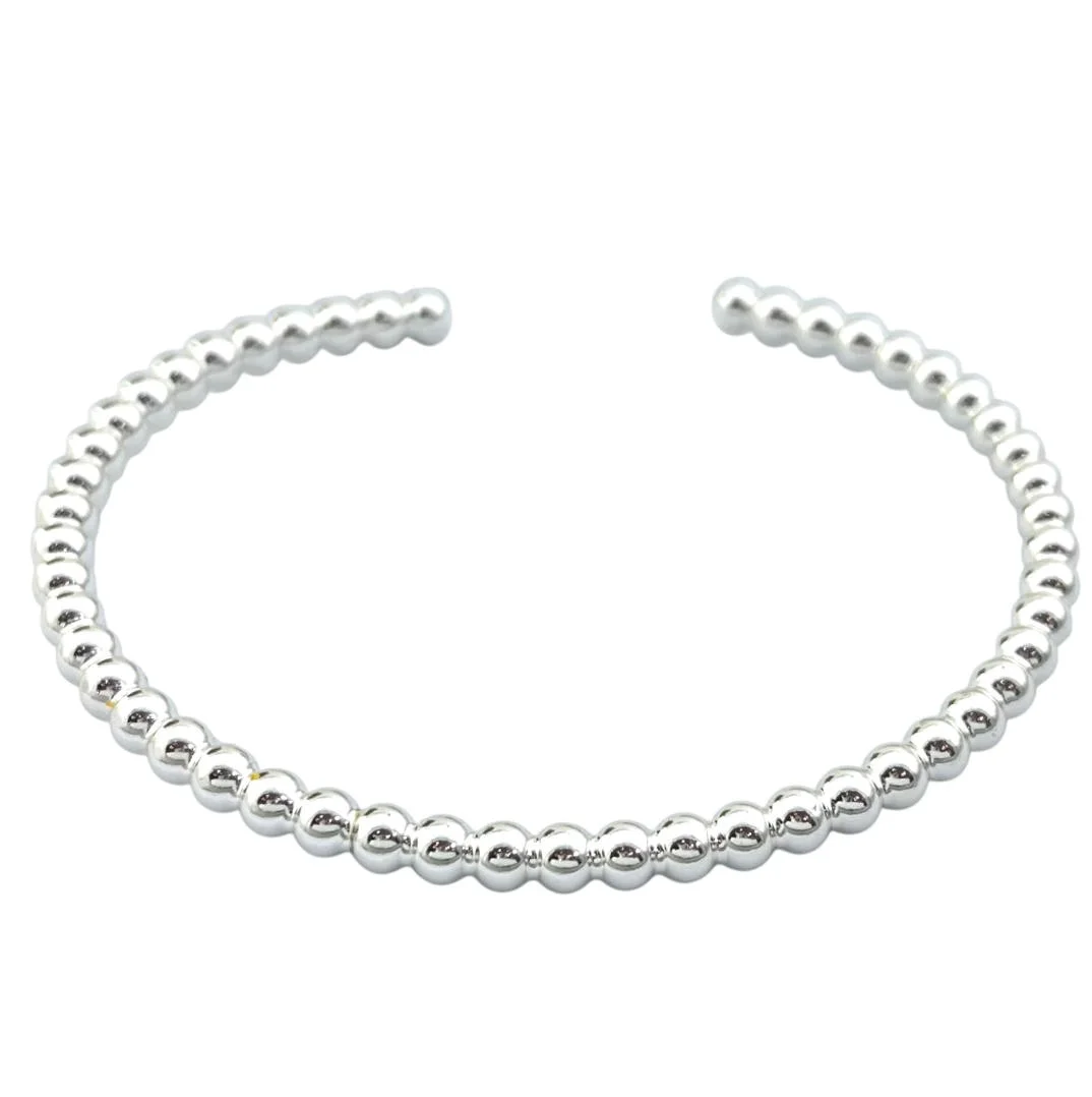 دستبند زنانه بنگل مدل اوربینا طرح گویهای نقرهای مینیمال