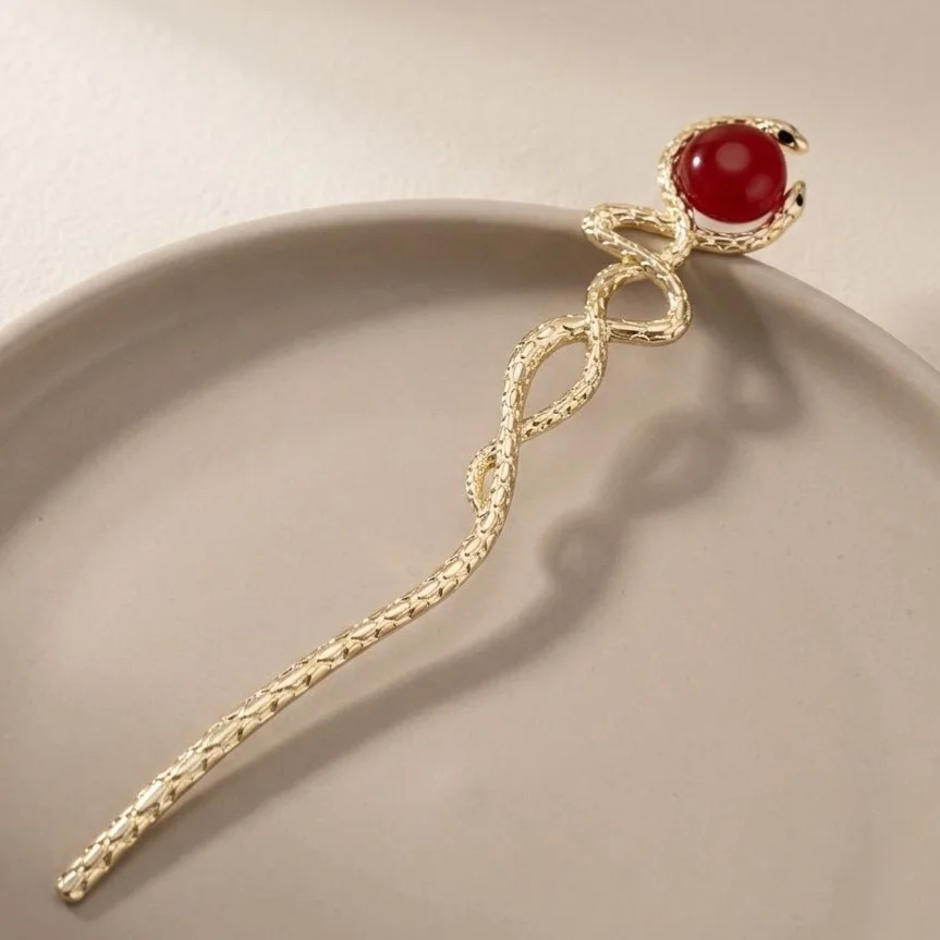 کانزاشی مو زنانه فلزی طرح گل و مار با نگین قرمز مدل روبِلیا