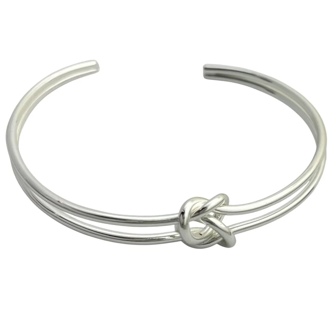 دستبند زنانه بنگل مدل سیلوکنات طرح گره مینیمال نقرهای