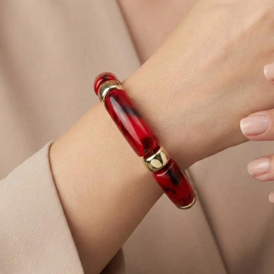 دستبند زنانه بنگل رزینی چندتکه مدل روبینورا یاقوتی‑طلایی