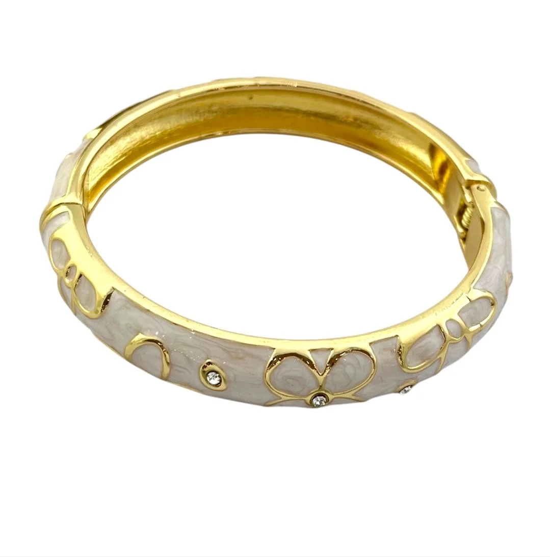 دستبند بنگل زنانه مدل ناهیدا طرح میناکاری سفید با فریم طلایی براق